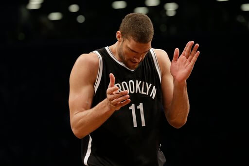 Brooklyn Nets center Brook Lopez reacts to a play during the first half in Game 3.  (AP Photo/Mary Altaffer)