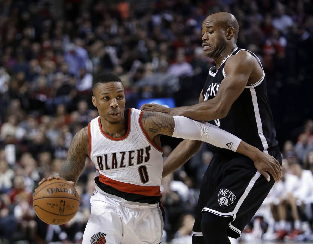The Nets have a tough task in stopping Damian Lillard. (AP)