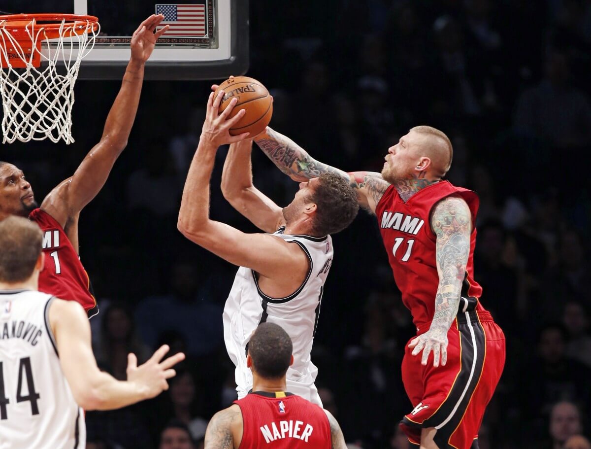 Chris Andersen, Chris Bosh, and the Miami Heat stifled Brook Lopez & the Nets Monday night. (AP)
