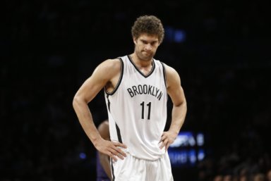 Brooklyn Nets' Brook Lopez (11) reacts after turning the ball over during the second half of an NBA basketball game against the Brooklyn Nets, Wednesday, March 4, 2015, in New York. The Hornets won the game 115-91. (AP Photo/Frank Franklin II)