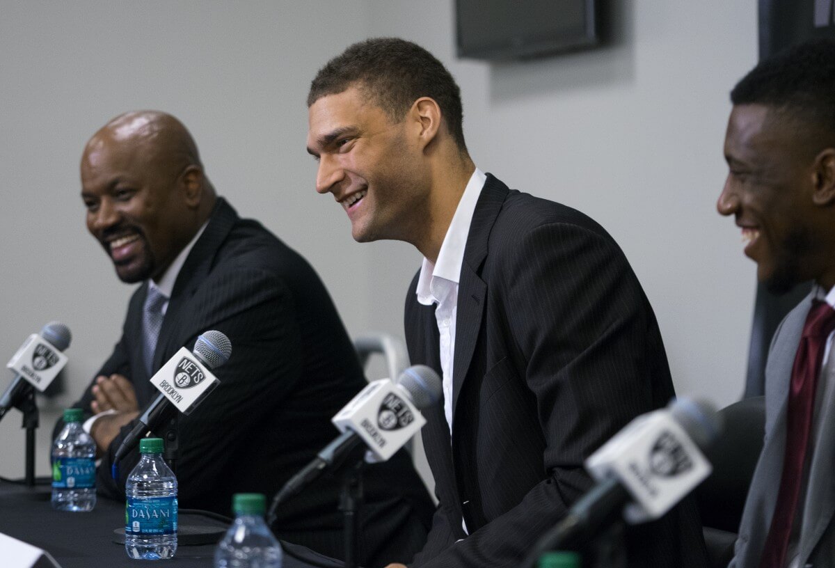 Billy King, Brook Lopez, Thaddeus Young Thursday morning. (AP)