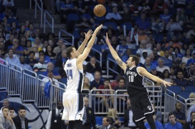 Orlando Magic forward Jason Smith (14) goes up for a shot in front of Brooklyn Nets guard Sergey Karasev (10), of Russia, during the second half of an NBA basketball game in Orlando, Fla., Tuesday, March 29, 2016. The Magic won 139-105. (AP Photo/Phelan M. Ebenhack)
