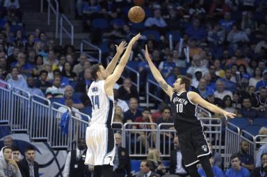 Orlando Magic forward Jason Smith (14) goes up for a shot in front of Brooklyn Nets guard Sergey Karasev (10), of Russia, during the second half of an NBA basketball game in Orlando, Fla., Tuesday, March 29, 2016. The Magic won 139-105. (AP Photo/Phelan M. Ebenhack)