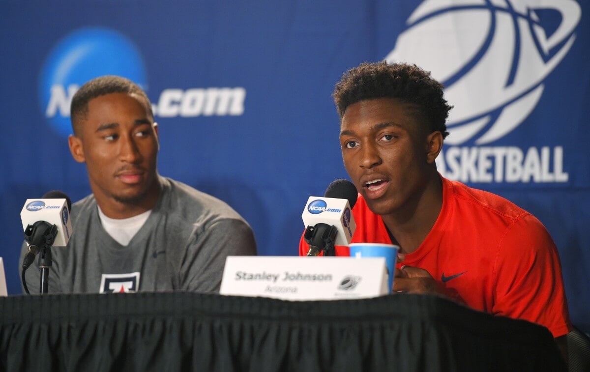 College teammates Rondae Hollis-Jefferson (left) and Stanley Johnson meet for the first time in the NBA. (AP)