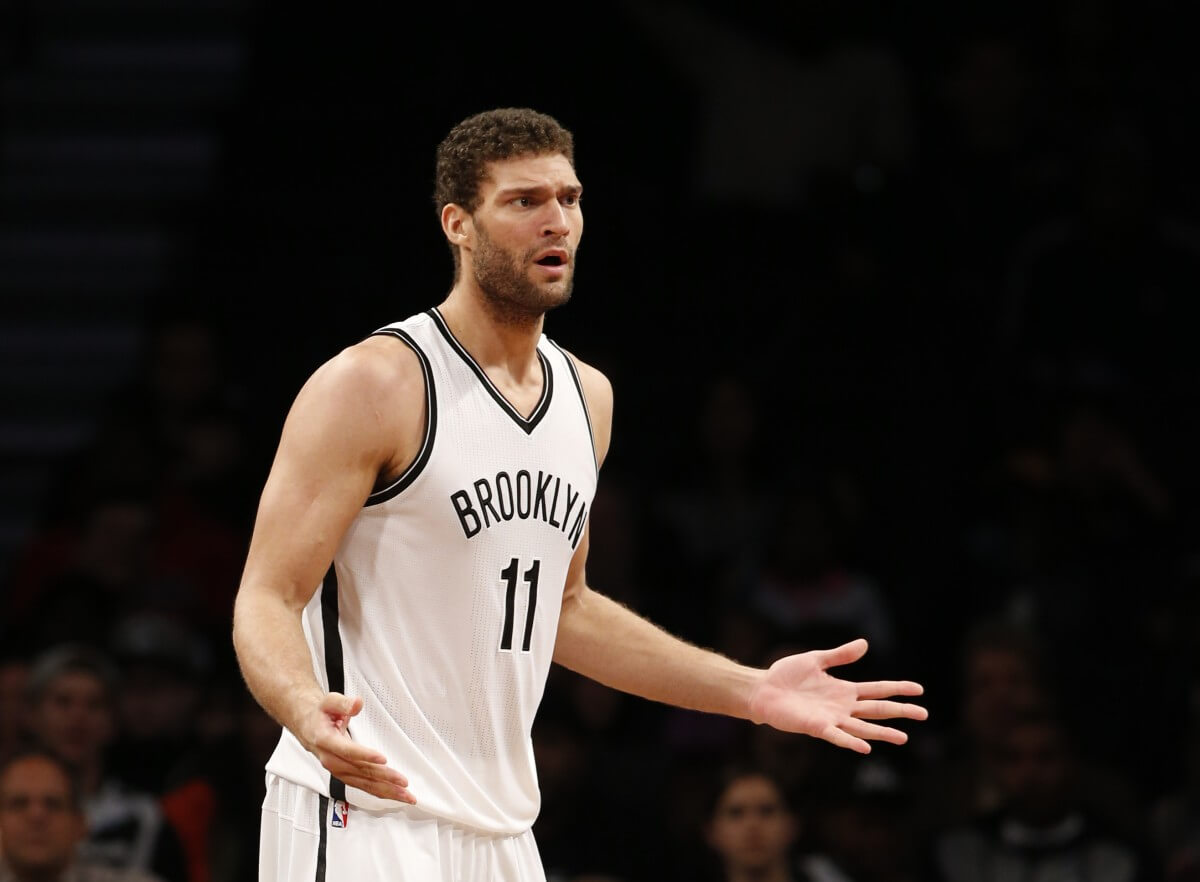 Brooklyn Nets center Brook Lopez (11) reacts after a foul call in the first half of an NBA basketball game, Sunday, Nov. 29, 2015, in New York. (AP Photo/Kathy Willens)