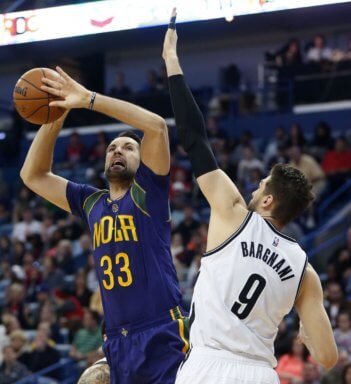 New Orleans Pelicans forward Ryan Anderson (33) goes to the basket against Brooklyn Nets center Andrea Bargnani (9) in the first half of an NBA basketball game in New Orleans, Saturday, Jan. 30, 2016. (AP Photo/Gerald Herbert)