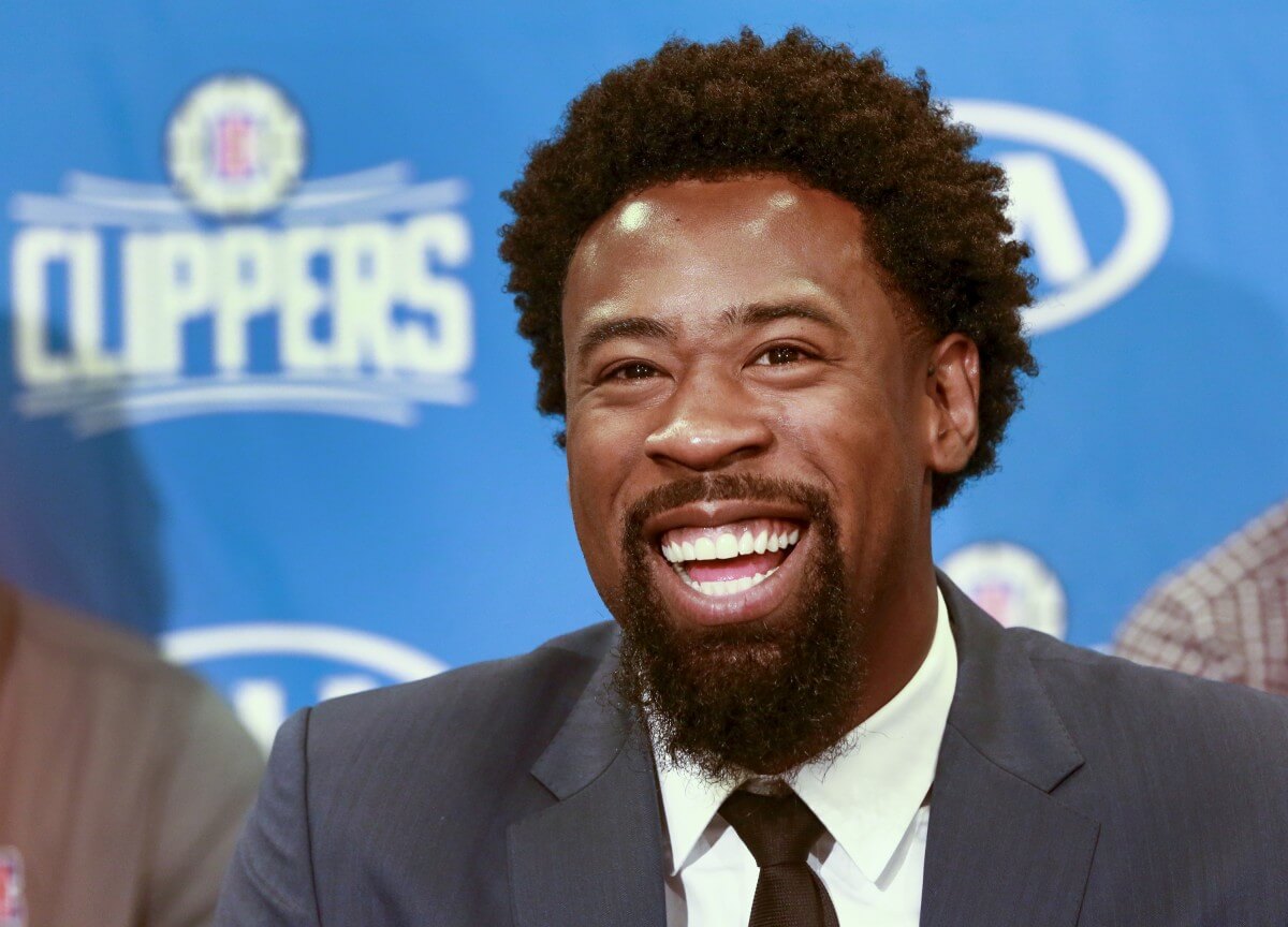 DeAndre Jordan is all smiles after returning to the Clippers. (AP)