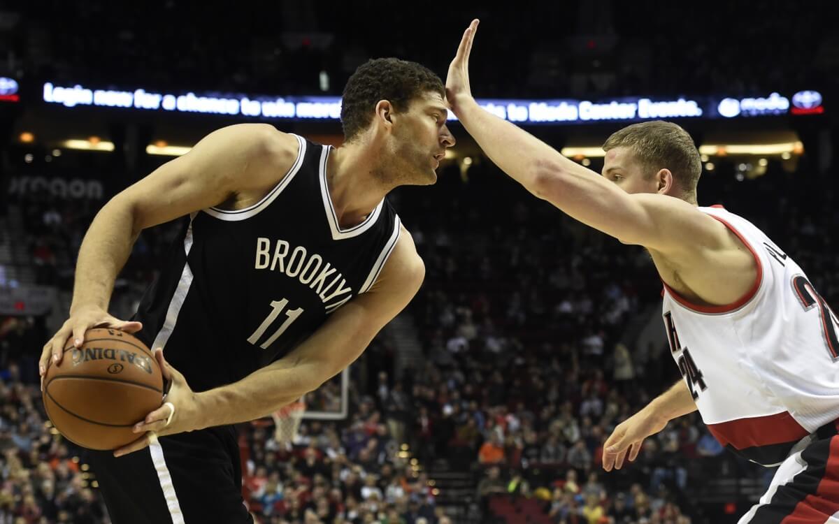 Brooklyn Nets center Brook Lopez (11) is defended by Portland Trail Blazers center Mason Plumlee (24) during the first half of an NBA basketball game in Portland, Ore., Tuesday, Feb. 23, 2016. (AP Photo/Steve Dykes)