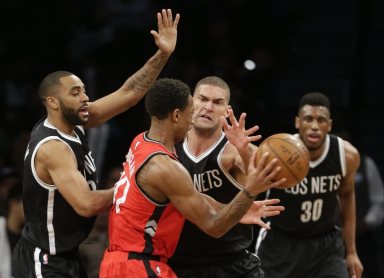 Brooklyn Nets' Brook Lopez defends Toronto Raptors' DeMar DeRozan during the second half of an NBA basketball game Wednesday, Jan. 6, 2016, in New York. The Raptors won 91-74. (AP Photo/Frank Franklin II)