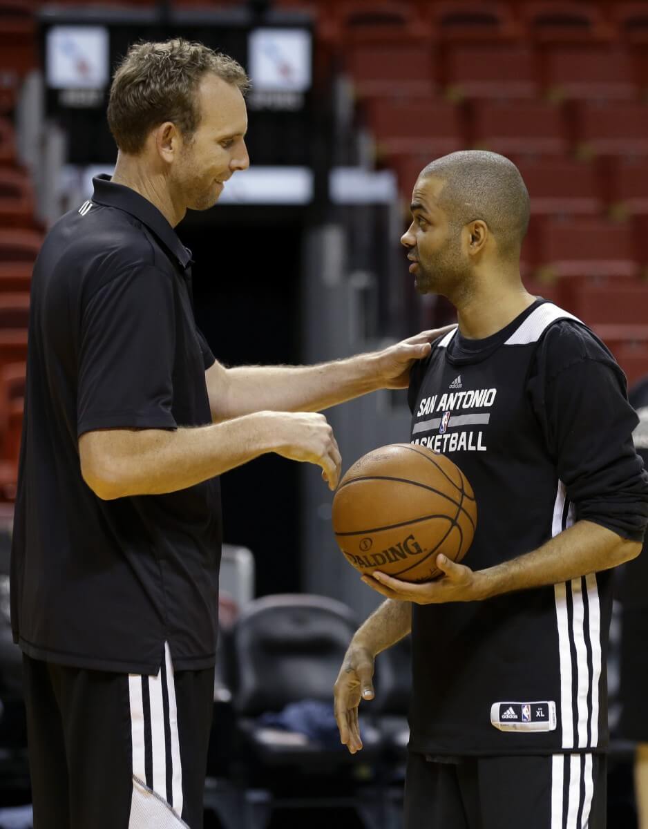 Sean Marks (left) with Tony Parker in 2014. Marks has been offered the Nets GM job. (AP)