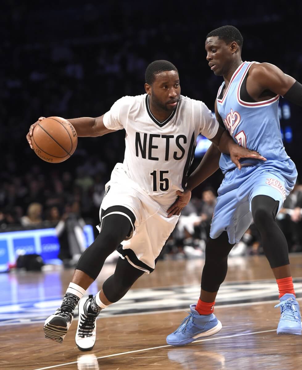 Brooklyn Nets guard Donald Sloan (15) drives the ball around Sacramento Kings guard Darren Collison (7) during the second half of an NBA basketball game Friday, Feb. 5, 2016, in New York. The Nets won 128-119. (AP Photo/Kathy Kmonicek)