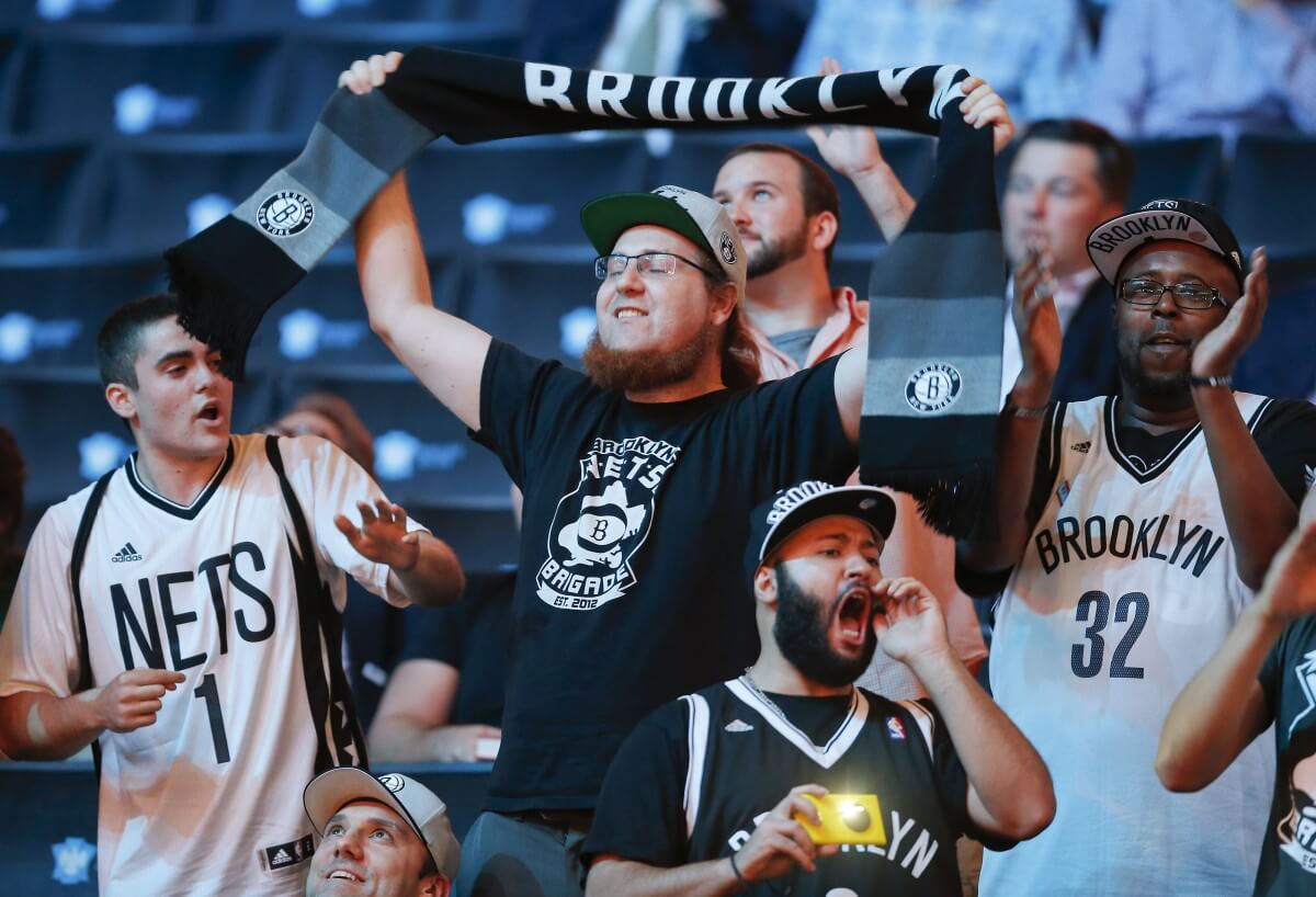 Nets fans celebrate after the team selected Chris McCullough with the 29th pick. (AP)