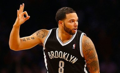 Deron-Williams-takes-a-look-at-the-monitor-thinks-his-new-tat-looks-A-OK.-Getty-Images-inset-via-Comedy-Central