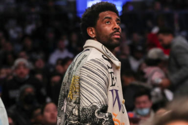 Nets guard Kyrie Irving enters Barclays Center during the second quarter of the team's game against the Knicks.